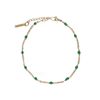 Goudkleurige armband met groene kraaltjes