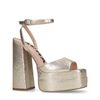 Goudkleurige platform pumps met plateau hak