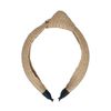 Beige haarband met knoop en gewoven structuur