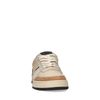 Lage beige leren sneakers met zwarte zool